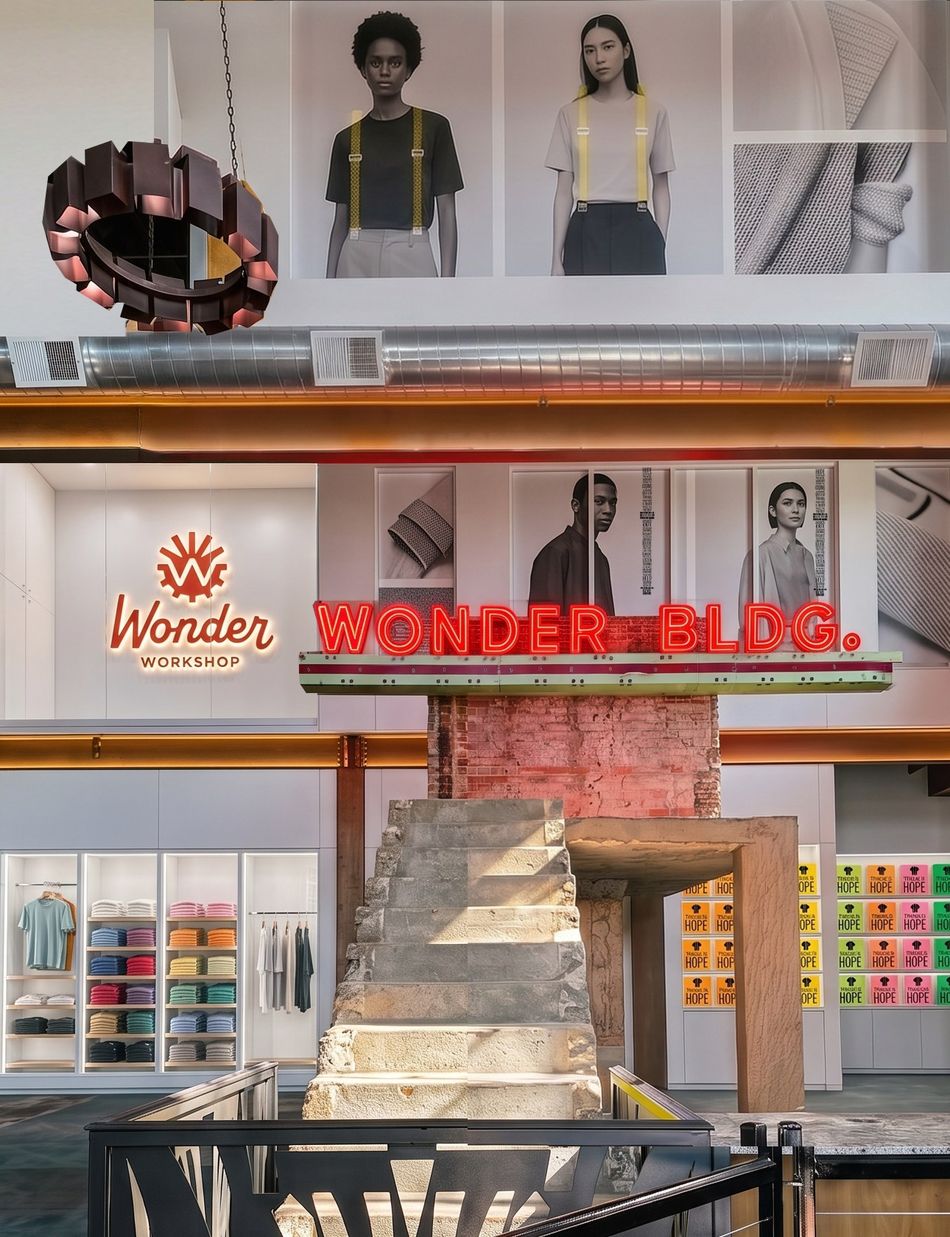 Inside the Wonder Building — the stone stair rising past the Wonderbilt sign toward the mezzanine